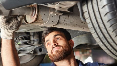 technician inspection and repair of the exhaust system of a vehicle Harmony Automotive Denver Aurora Centennial Greeley Colorado